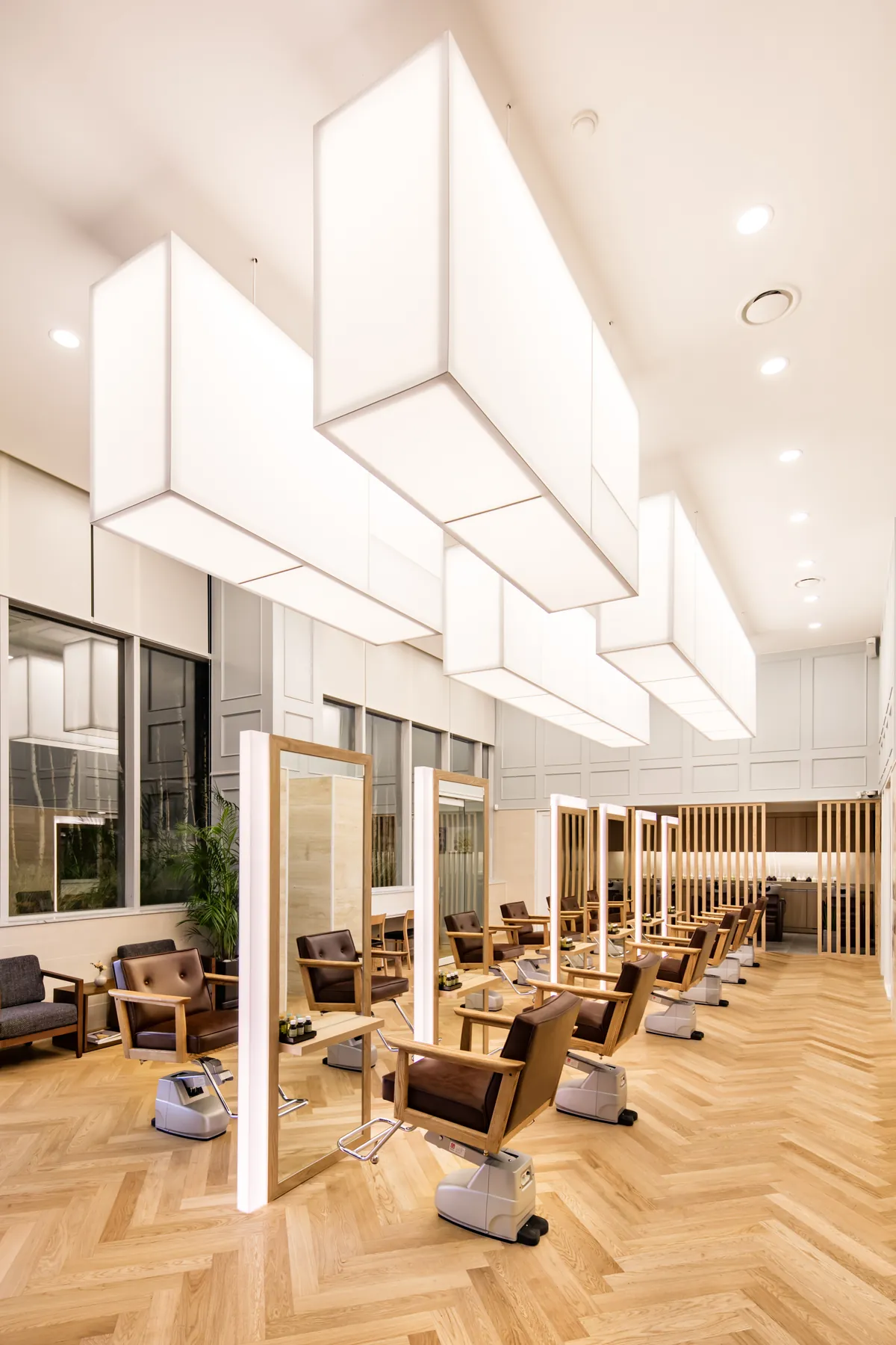 Waiting lounge under the sculpted ceiling lights · RARIEN Gangnam